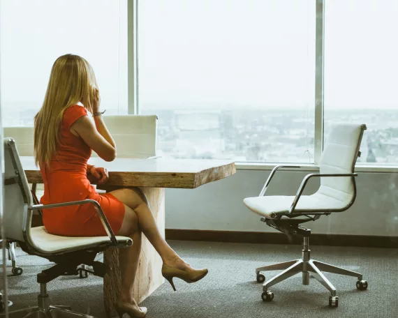 woman in conference room on telephone